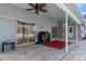 Covered patio with pavers, ceiling fan, and grill at 22921 Sterling Manor Loop, Lutz, FL 33549