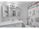 Bathroom with single sink vanity, shower/tub combo, and linen closet at 2400 Winding Creek Blvd # 24-203, Clearwater, FL 33761