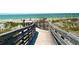 Relaxing beach access with wooden walkway at 2400 Winding Creek Blvd # 24-203, Clearwater, FL 33761