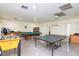 Game room features pool table, ping pong, and foosball at 2400 Winding Creek Blvd # 24-203, Clearwater, FL 33761