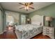 Main bedroom with a white bed frame and ceiling fan at 2447 Ecuadorian Way # 1, Clearwater, FL 33763