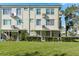 Exterior view of building, showing landscaping and lawn at 2447 Ecuadorian Way # 1, Clearwater, FL 33763