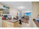 Kitchen with island, view of living room, and tile flooring at 2707 1 St, Indian Rocks Beach, FL 33785