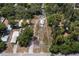 Aerial view of vacant lot with two houses and surrounding vegetation at 3300 70Th N Ave, St Petersburg, FL 33702