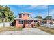 Front exterior of a two-story home with a driveway and small yard at 3306 N Howard Ave, Tampa, FL 33607