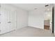 Spacious bedroom with plush carpet, double door closet, and access to hallway at 709 W Orient St, Tampa, FL 33603