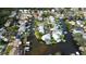 Aerial view of waterfront community, highlighting houses and canals at 81 Gulfwinds Dr, Palm Harbor, FL 34683