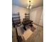 Modern home office with a desk, shelving, and stylish rug at 8518 Primrose Willow Pl, Odessa, FL 33556