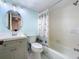 Updated bathroom with a shower/tub combo and vanity at 8950 Park Blvd # 605, Seminole, FL 33777