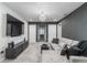 Upstairs living room featuring neutral walls, a tv, and a modern sofa with an open doorway at , Odessa, FL 33556