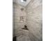 Large walk-in shower with neutral tile and built-in shelving at 1108 Stevenson Ave, Clearwater, FL 33755