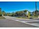 Modern home with a stone wall and lush landscaping visible from the street at 1108 Stevenson Ave, Clearwater, FL 33755