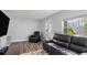 Relaxing living room featuring leather recliners, wood floors, and a brick accent wall at 139 Tennessee Ne Ave, St Petersburg, FL 33702