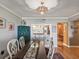 Dining area with kitchen pass-through and hardwood floors at 14810 Rue De Bayonne # 7F, Clearwater, FL 33762