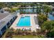 Resort-style community pool with plenty of lounge chairs at 14810 Rue De Bayonne # 7F, Clearwater, FL 33762