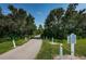 Paved walking trail through lush green landscape at 1603 Council Dr, Sun City Center, FL 33573