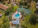 Aerial view of community pool, spa, and tennis court at 2345 Bentley Dr, Palm Harbor, FL 34684