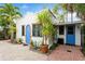 View of the home's exterior, showcasing its stucco facade and blue door at 243 19Th Ne Ave, St Petersburg, FL 33704