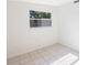 Bright bedroom with tile floor and window at 2434 18Th N Ave, St Petersburg, FL 33713