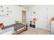 bedroom with twin bed, storage, and playful decor at 25028 Hyde Park Blvd, Land O Lakes, FL 34639