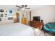 Bedroom with queen bed, ceiling fan and dresser at 25028 Hyde Park Blvd, Land O Lakes, FL 34639