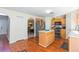 Kitchen with island, stainless steel appliances, and wood cabinets at 25028 Hyde Park Blvd, Land O Lakes, FL 34639