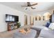 Open living room with a view of the kitchen and staircase at 25028 Hyde Park Blvd, Land O Lakes, FL 34639