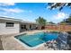 Refreshing pool with surrounding patio at 3145 Fiesta Dr, Dunedin, FL 34698