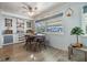 Bright dining area with round table and chairs near the kitchen and living room at 37820 Madeira Ave, Zephyrhills, FL 33541