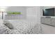 Cozy bedroom with a neutral color palette and modern dresser with aquarium at 4444 Swift Rd # 20, Sarasota, FL 34231
