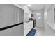 Modern kitchen with stainless steel refrigerator and white cabinetry at 4444 Swift Rd # 20, Sarasota, FL 34231