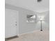 Bright living room features neutral paint, plush carpeting, and a charming lamp at 4444 Swift Rd # 20, Sarasota, FL 34231