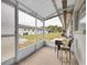 The outdoor patio is cozy and inviting, with a chair and small table, and open space at 4444 Swift Rd # 20, Sarasota, FL 34231