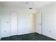 Spacious bedroom with green carpet and two closets at 4859 Independence Dr, Bradenton, FL 34210