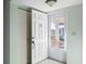 Condo entryway with white door and closet at 4859 Independence Dr, Bradenton, FL 34210
