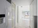 View from kitchen into living area with tile floors at 4859 Independence Dr, Bradenton, FL 34210
