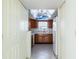 Kitchen with wood cabinets, a skylight, and white appliances at 4859 Independence Dr, Bradenton, FL 34210