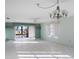 Spacious living room featuring tile floors and access to a canal view at 4859 Independence Dr, Bradenton, FL 34210