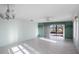 Bright living room with tile floors, water views, and sliding glass doors at 4859 Independence Dr, Bradenton, FL 34210