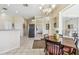 Kitchen views and a cozy dining area with a table and chairs at 4930 Cedar Oak Way, Sarasota, FL 34233