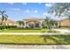 Single-story home with tile roof, landscaping, and a two-car garage at 4930 Cedar Oak Way, Sarasota, FL 34233