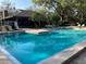 Community swimming pool and recreational clubhouse, perfect for outdoor enjoyment at 506 Lennox W Rd, Palm Harbor, FL 34683