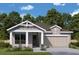 Two-story house with light beige walls, white columns, and a two-car garage at 5137 4Th N Ave, St Petersburg, FL 33710