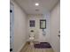 Clean bathroom with white vanity, modern fixtures, and wood-look floors at 5310 10Th N St, St Petersburg, FL 33703