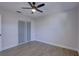 Well-lit bedroom with wood-look floors and a large closet at 5310 10Th N St, St Petersburg, FL 33703