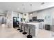 Modern kitchen with white cabinets, quartz countertops, and island at 6609 114Th E Ave, Parrish, FL 34219