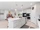 Large kitchen island with seating, white cabinets and quartz countertops at 6609 114Th E Ave, Parrish, FL 34219