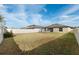 Large backyard with grassy area and patio space at 6807 King Creek Dr, Sun City Center, FL 33573