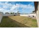 Spacious backyard with grassy area, fenced perimeter, and patio at 6807 King Creek Dr, Sun City Center, FL 33573