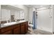 Double vanity bathroom with shower and tile flooring at 6807 King Creek Dr, Sun City Center, FL 33573